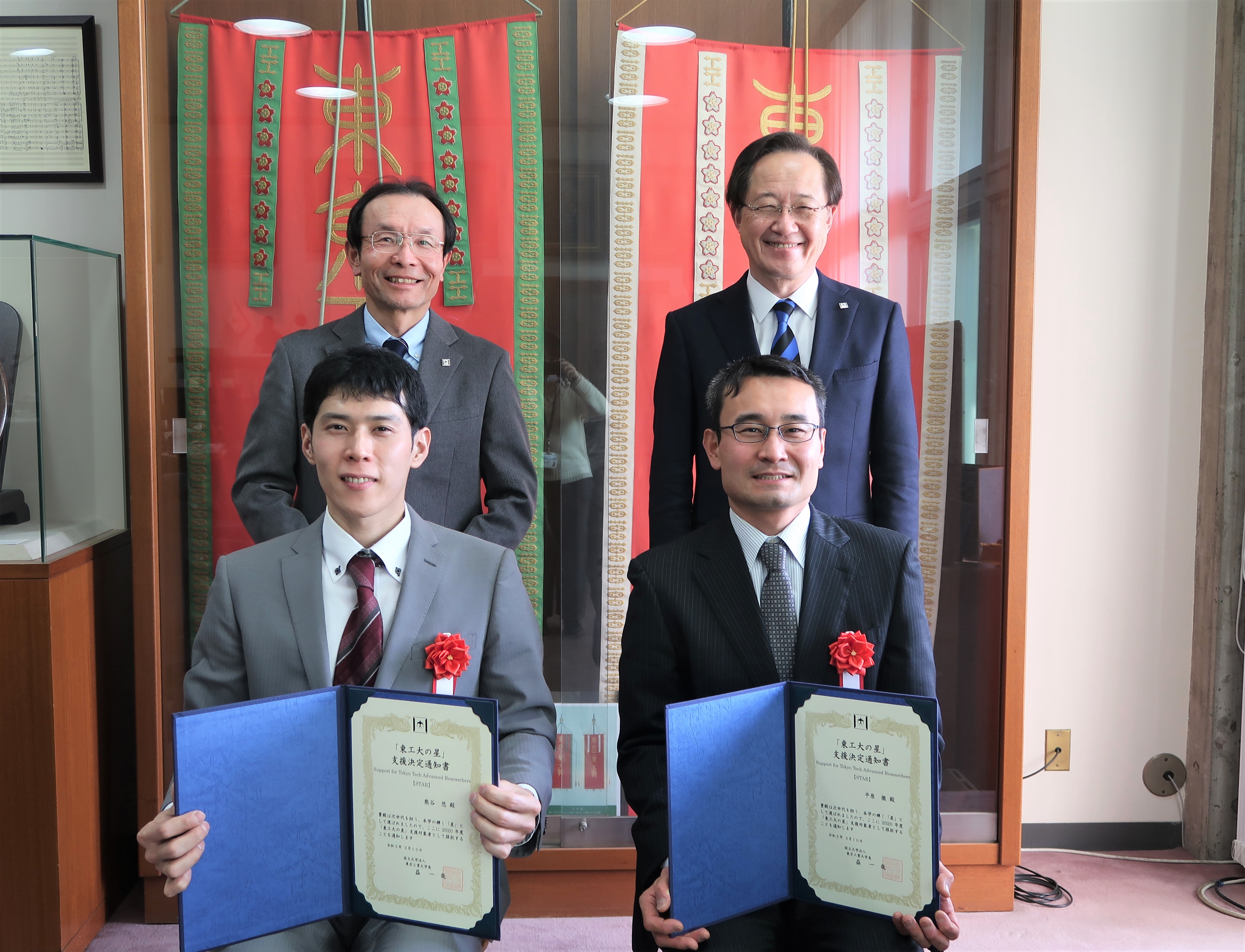 (counterclockwise from front left) Kitano, Inagi, EVP for Research Osamu Watanabe, President Kazuya Masu